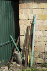 Pipes beside the brick wall.