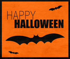 happy Halloween design with bats on wood grain texture