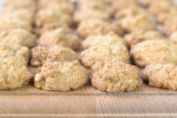 Homemade cookies from wholemeal flour on a wooden stand.