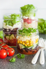 healthy vegetable cheese salad in mason jars