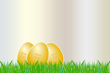 Three golden eggs with white borders and golden inscription Happy Easter are lying on the grass. 