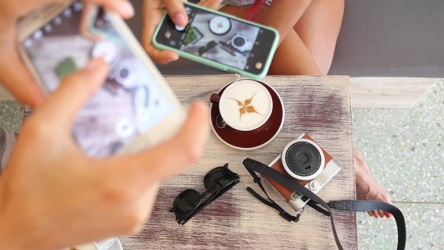 Top View of Smartphone Photographing Coffee Cup