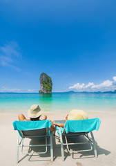 Couple on the beach at tropical resort Travel