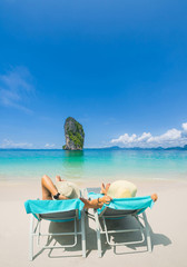 Couple on the beach at tropical resort Travel