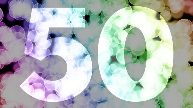 Fifty to fifty one years birthday fade in/out animation with color gradient moving bokeh background. Animation: 90 frames still with number, 180 fade out, 30 clear, 180 fade in, 300 still.
