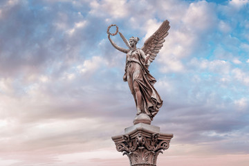 The statue of the Muse or angel near Rudolfinum building in Prague.