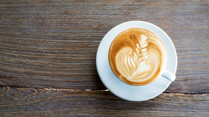 Hot coffee on a wooden table.