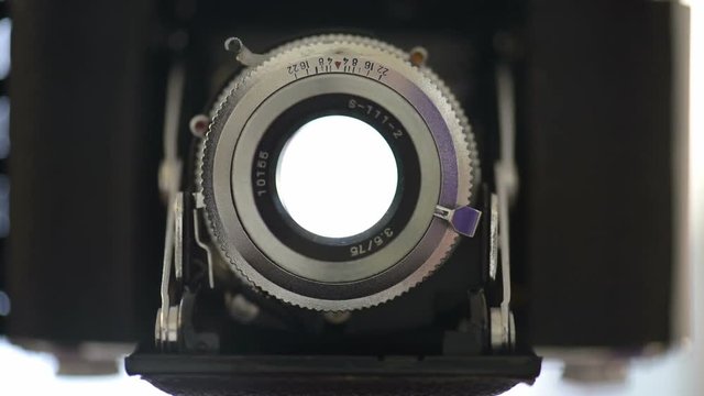 Old photo camera shutter which is triggered