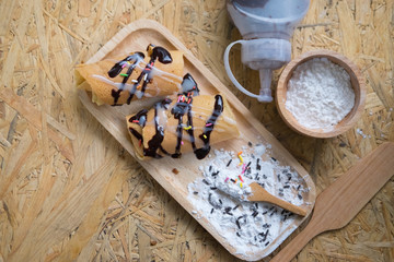 Pancake topping with sauce chocolate and icing