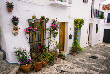 Flowerpots hung on the wall in Andalucia, Spain
