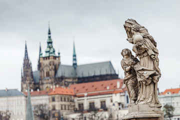 Fototapeta na wymiar View from Charles bridge on Statue of St. Anna and lesser town with St. Vitus Cathedral