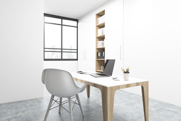 Corner of a workplace, white chair
