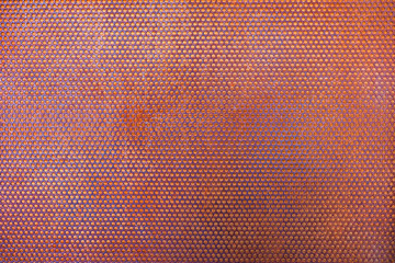 Steel grating rusty with circular holes, background texture