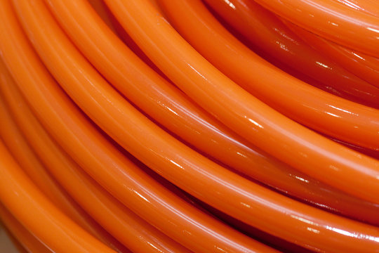 Twisted orange watering hose