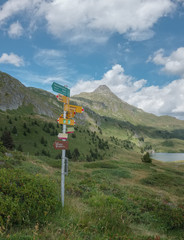 Signpost for hikers in Swiss Alpine landscape, near Bettmeralp, Switzerland.
