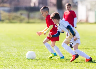 Foto op Canvas Kids soccer football - children players match on soccer field © Dusan Kostic