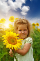 Fototapeta premium girl and sunflower on the field
