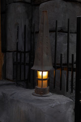 Naklejka premium Mystical image of an old lantern at a wooden wall.