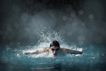 Swimmer man. Portrait of swimming athlete with goggles after tra