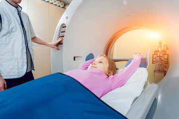 Medical equipment. Doctor and patient in the room of computed tomography