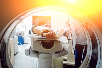 Medical equipment. Doctor and patient in the room of computed tomography