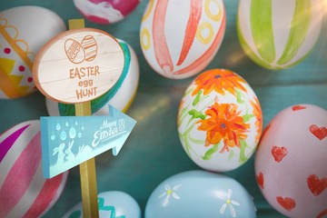 Composite image of easter egg hunt sign