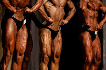 Fototapeta athlete bodybuilder abdominal thigh pose bodybuilding competitions obraz