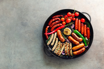 Grilled sausages in a pan