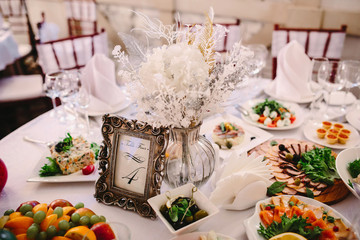 Number 7 in the frame at guest table on wedding reception.
