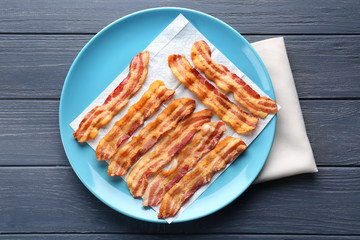 Fried bacon slices on plate