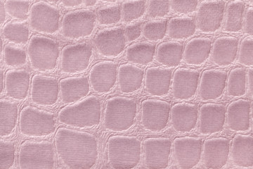 Pink background from soft upholstery textile material, closeup. Fabric with pattern