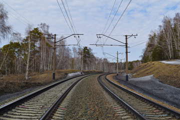 Trans-siberian railway in Siberian taiga forest in spring. Novosibirsk, Siberia, Russia.