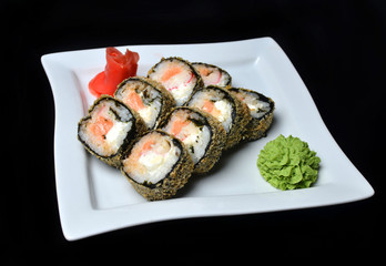 Sushi roll banzai. Hot roll philadelphia with shrimp on a plate.

