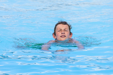 boy swimming in the pool