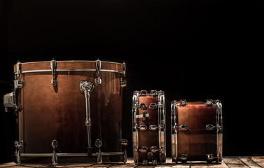 Obraz na płótnie Canvas drums, musical percussion instruments on a black background