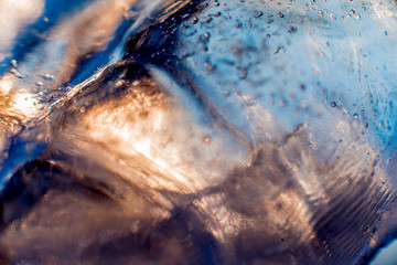 Fototapeta na wymiar Beautiful abstract background. Ice close-up. The play of light.