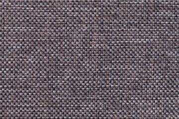 Dark brown textile background closeup. Structure of the fabric macro