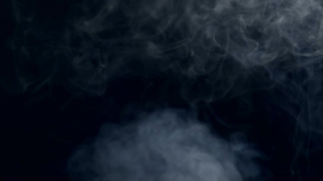 Smoke on a black background in slow motion. 