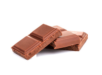 Broken chocolate pieces on white background