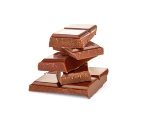 Broken chocolate pieces on white background