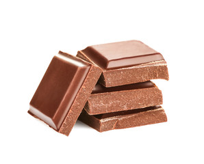 Broken chocolate pieces on white background
