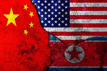 Cracks in the wall. Flags: USA, China, North Korea