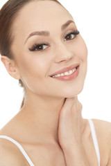 Feel of healthy skin. Cropped studio shot of a young beautiful female model smiling touching her neck looking to the camera.