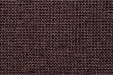 Brown textile background with checkered pattern, closeup. Structure of the fabric macro.