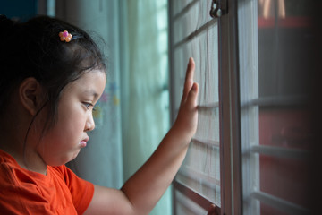 Hand with metal fence, feeling no freedom.