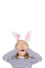 Great surprise for her. Shot of a pretty little girl covering her eyes with her hands waiting for a surprise copyspace above her isolated on white.