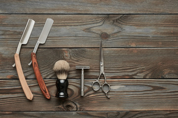 Vintage barber shop tools on wooden background