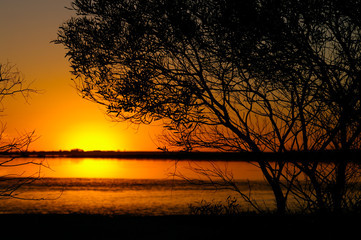 Fototapeta na wymiar A beautiful orange Sunset looking outwards to the Southern Ocean from South Australia