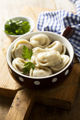 Homemade dumplings with butter and parsley