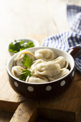 Homemade dumplings with butter and parsley